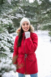 Photo of Happy young woman outdoors on winter day