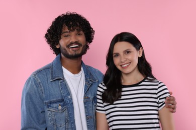 Photo of International dating. Portrait of happy couple on pink background