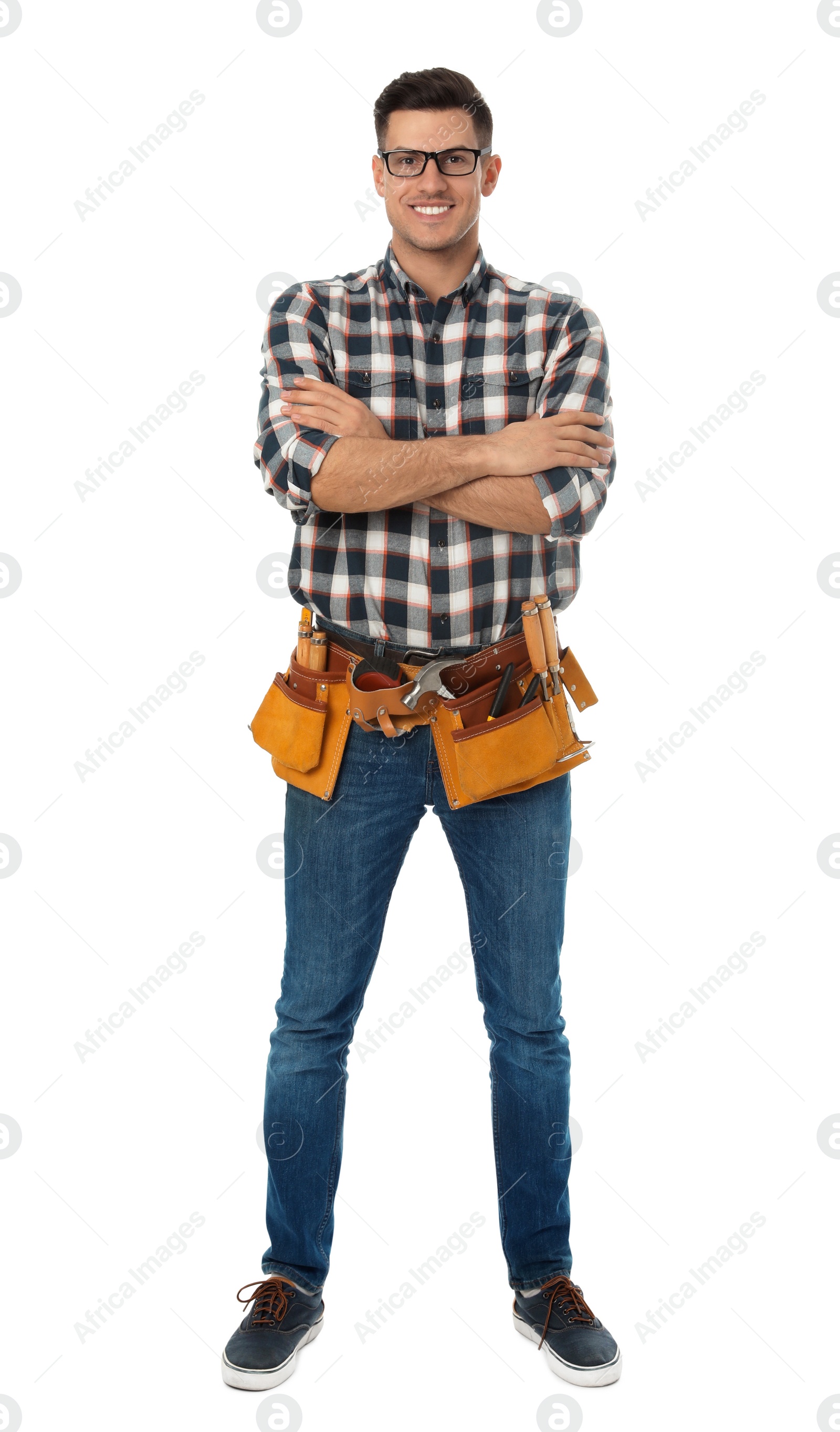 Photo of Handsome carpenter with tool belt isolated on white