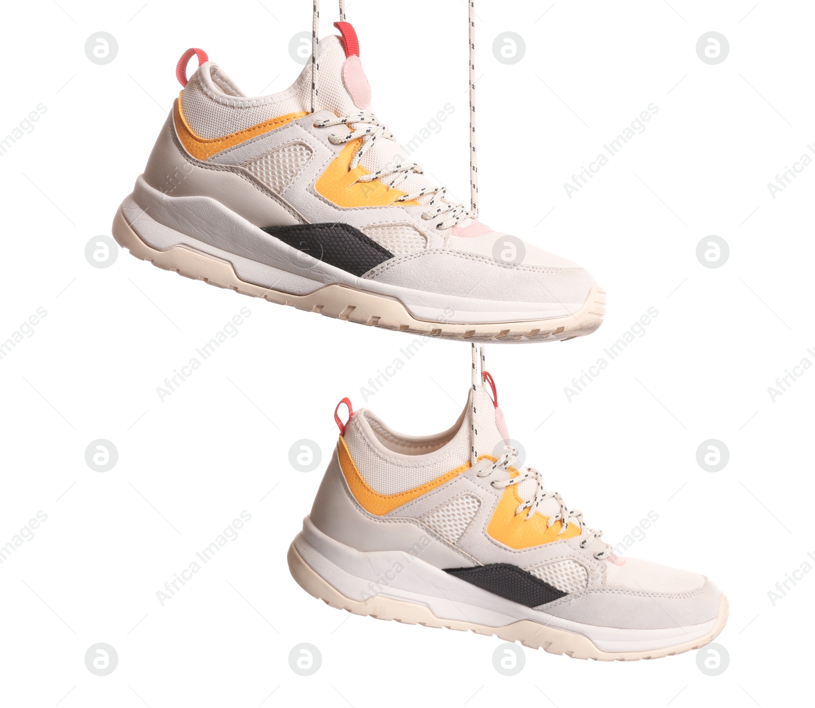 Photo of Pair of sports shoes on white background