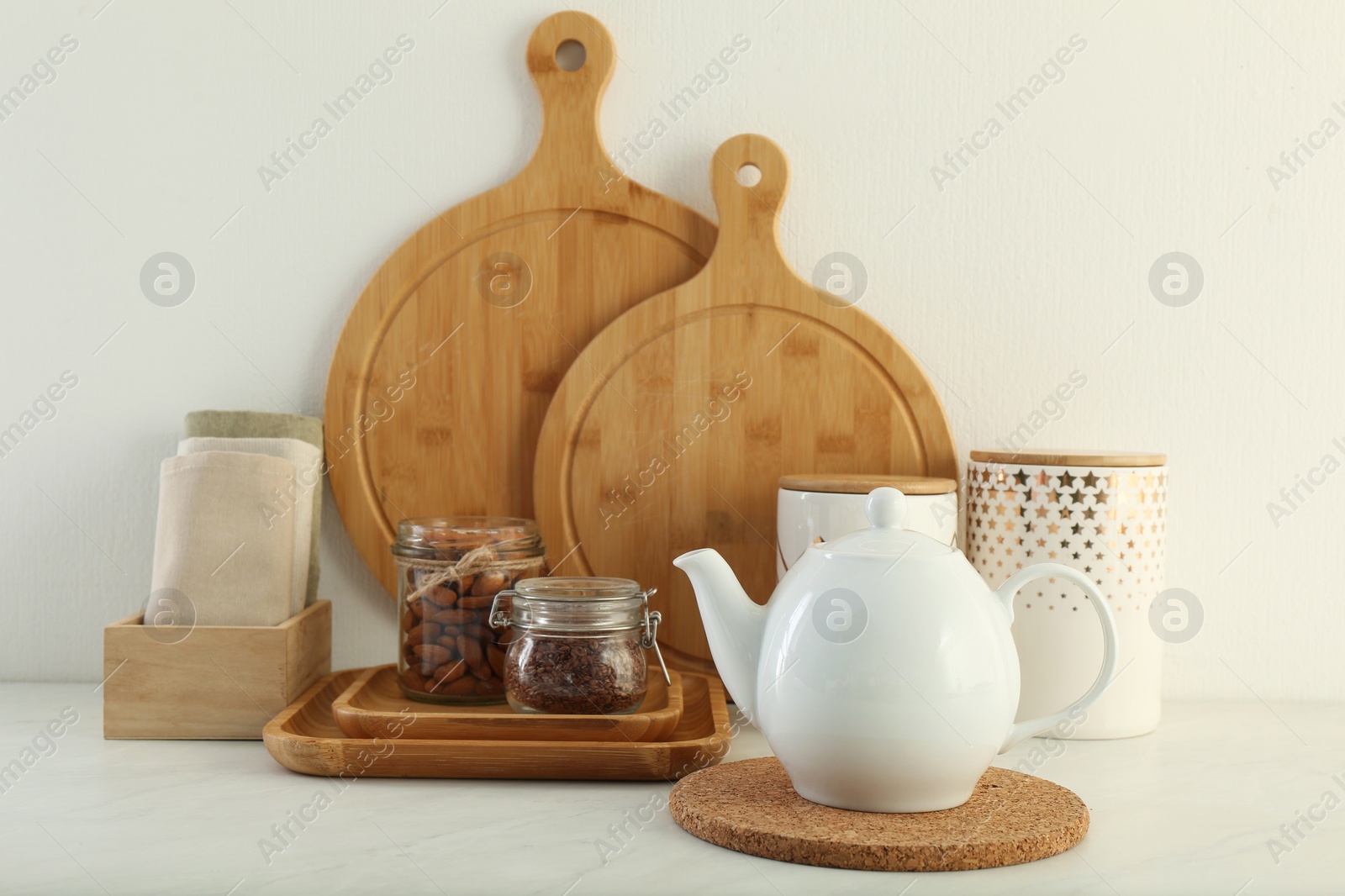 Photo of Modern kitchenware and products on white marble table