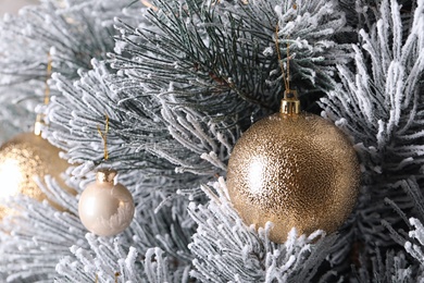 Photo of Beautiful Christmas tree with festive decor as background, closeup