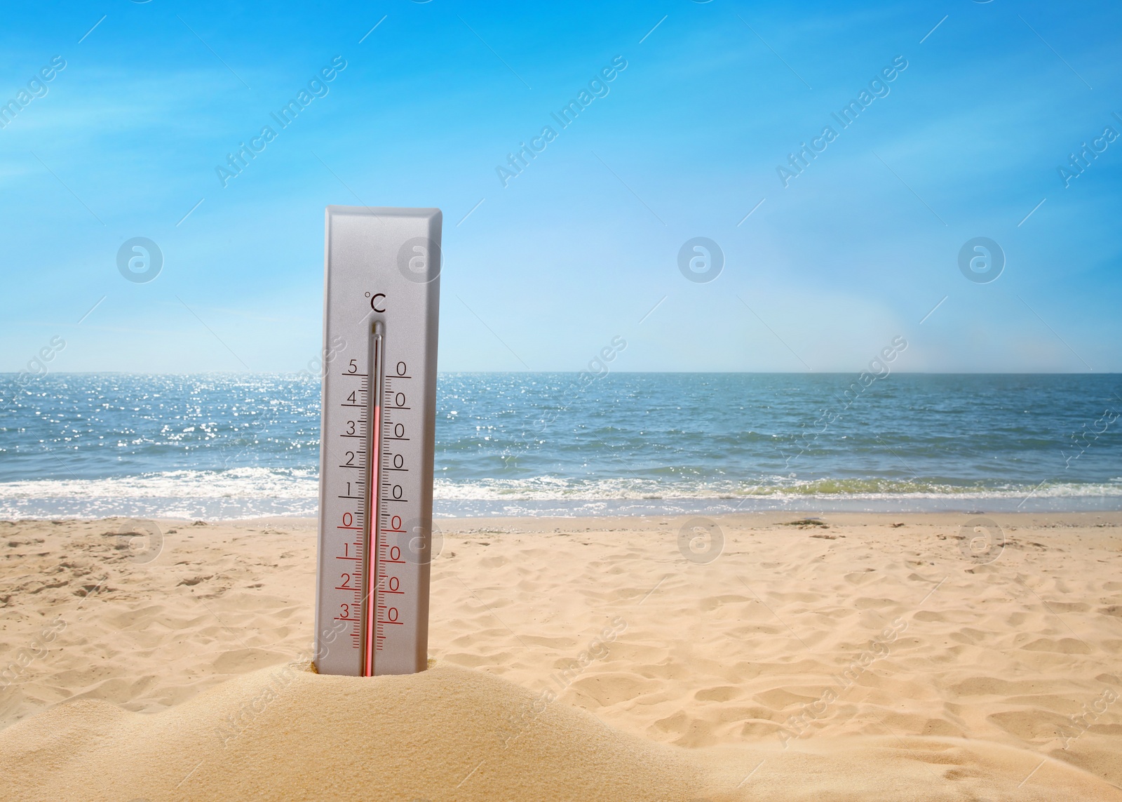 Image of Weather thermometer on sandy seashore, space for text