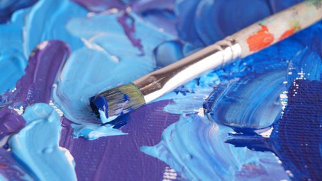 Brush on canvas with mixed bright paints, closeup