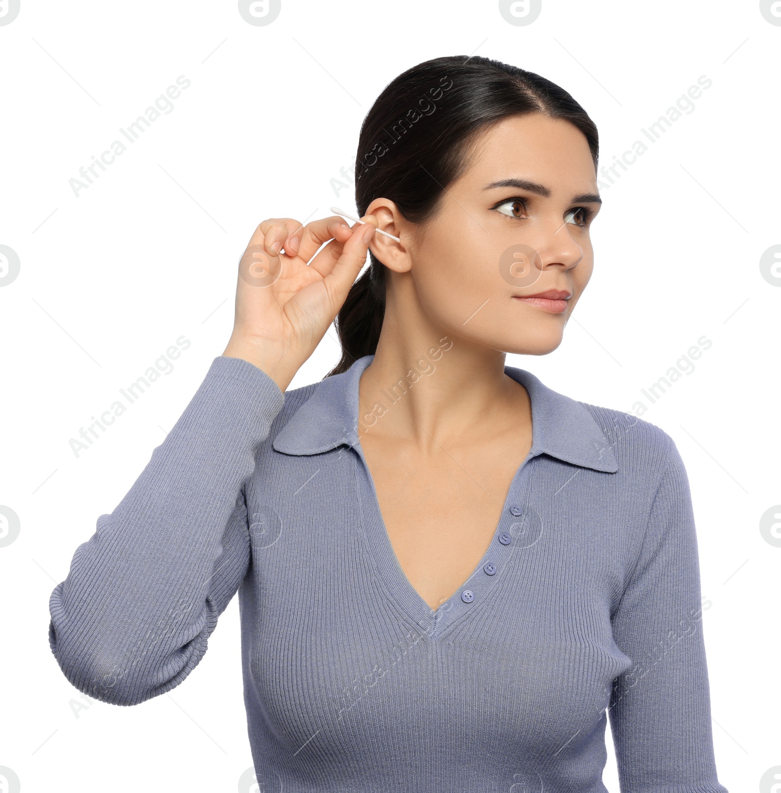 Photo of Young woman cleaning ear with cotton swab on white background