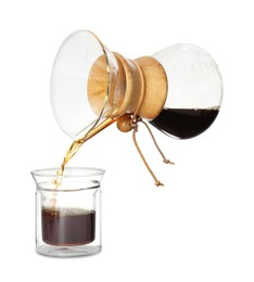 Pouring coffee from chemex coffeemaker into glass isolated on white