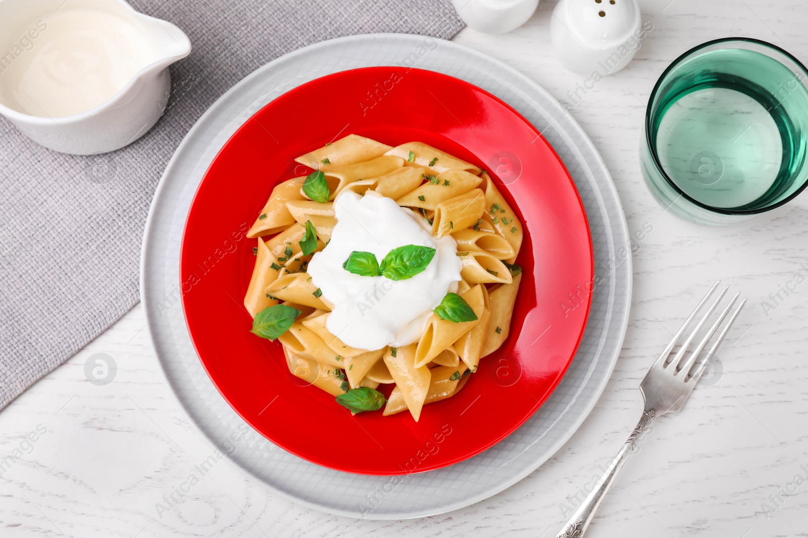 Photo of Flat lay composition with tasty pasta on white wooden table