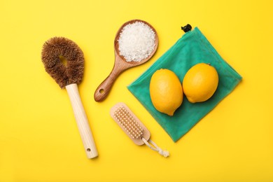 Photo of Flat lay composition with eco friendly products on yellow background