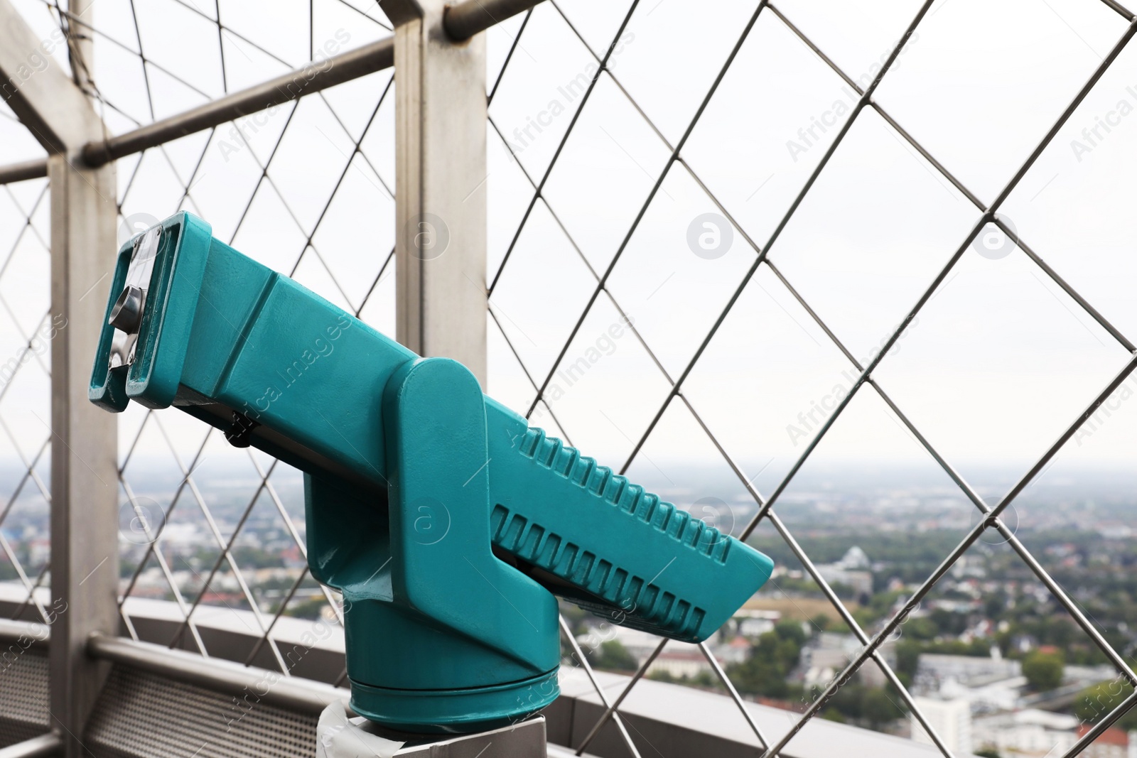 Photo of Green metal tower viewer on observation deck. Space for text