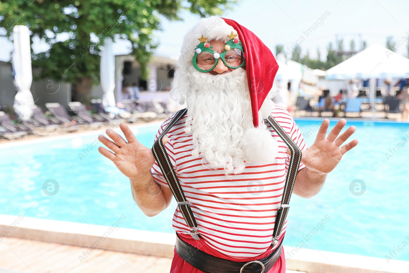 Photo of Authentic Santa Claus with funny glasses at resort
