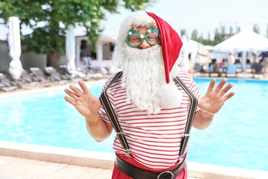 Authentic Santa Claus with funny glasses at resort