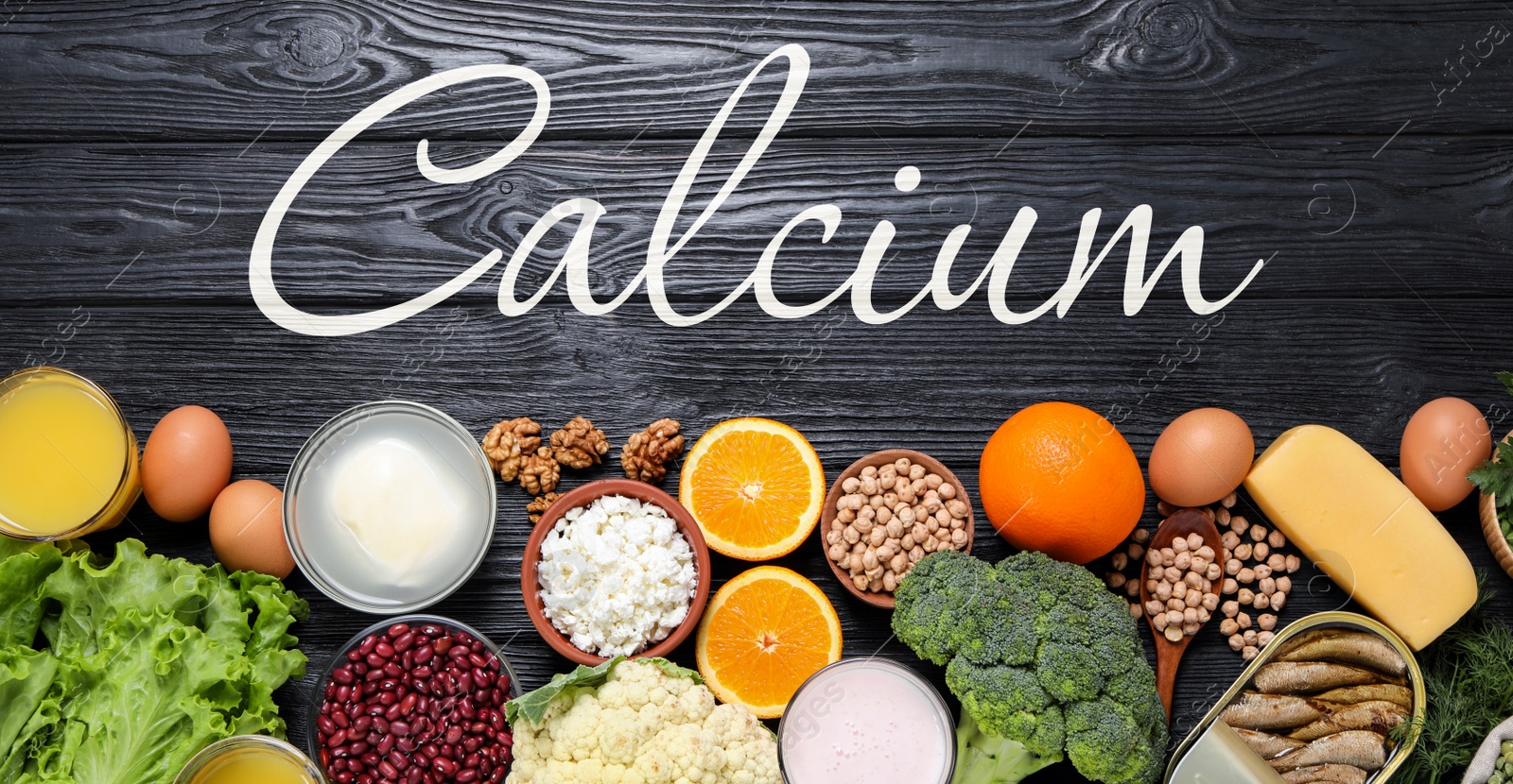 Image of Different fresh products with high amounts of easily absorbable calcium on black wooden table, flat lay