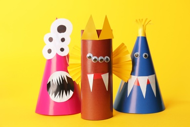 Funny monsters on yellow background. Halloween decoration