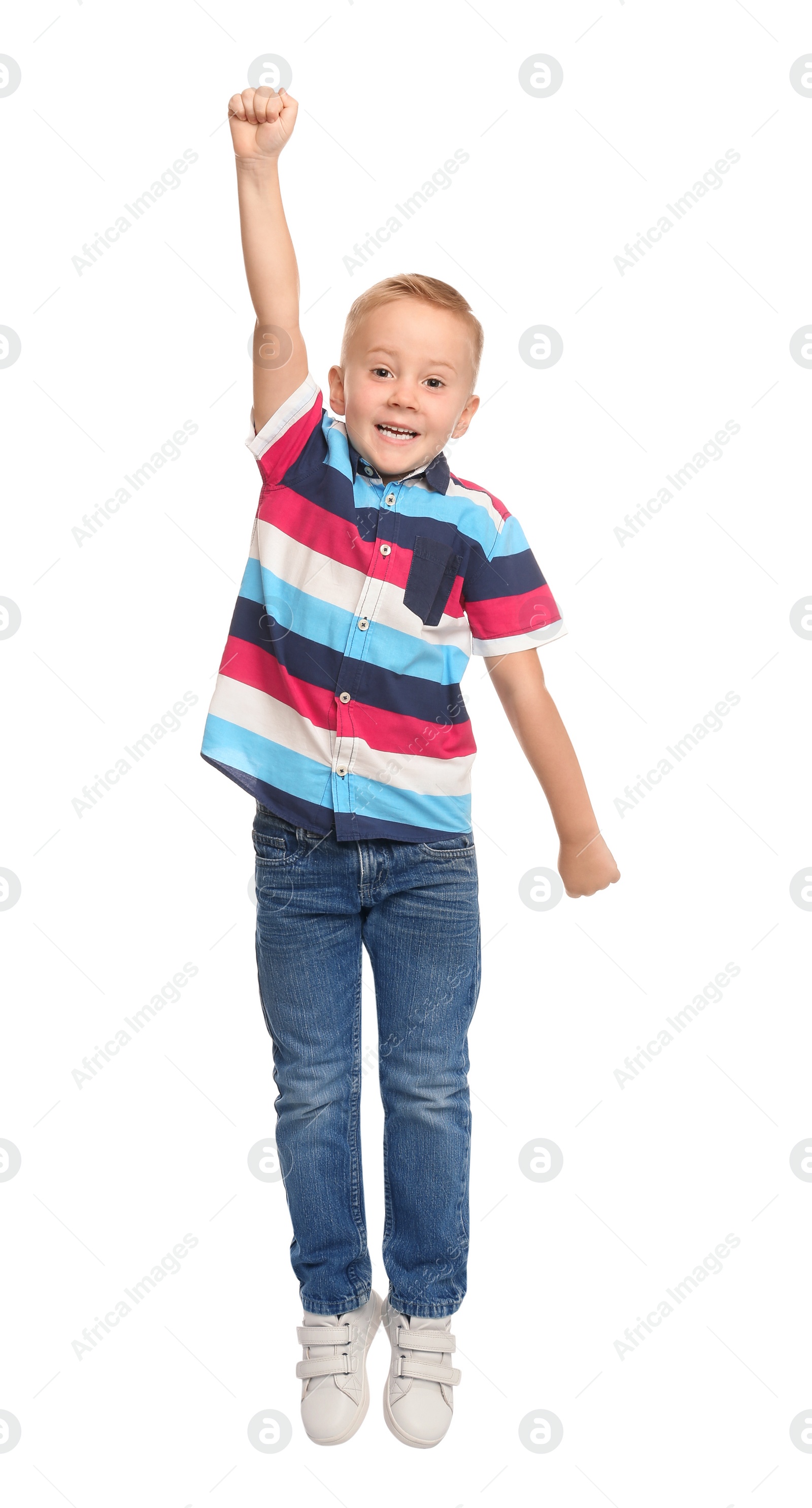 Photo of Cute little boy jumping on white background