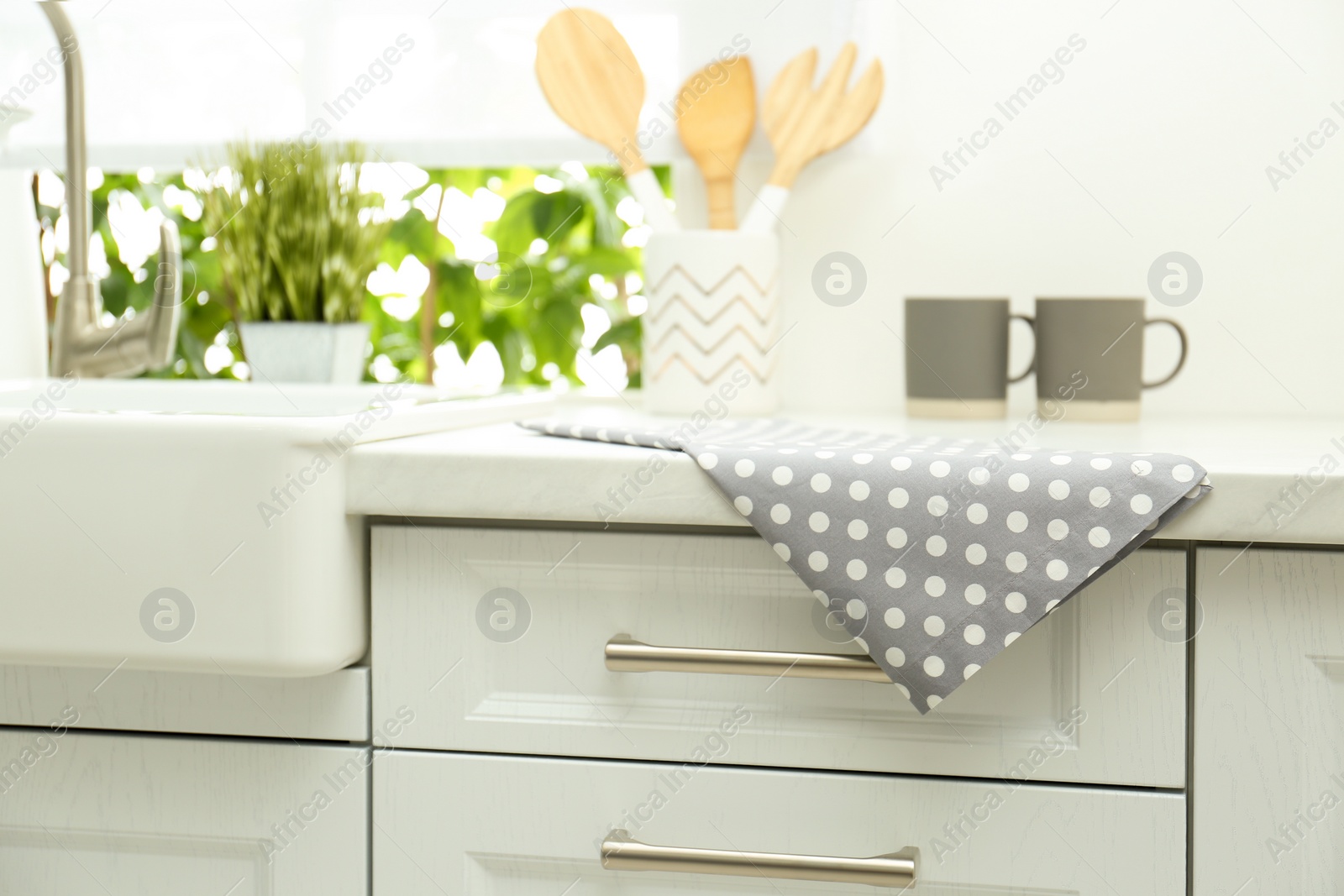 Photo of Cotton towel on countertop in modern kitchen