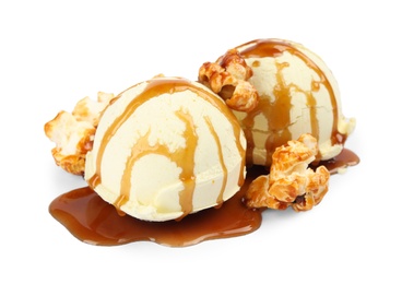 Photo of Delicious ice cream with caramel popcorn and sauce on white background