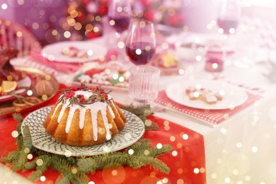 Image of Festive dinner with delicious cake served on table indoors. Christmas Eve celebration