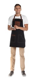 Full length portrait of happy young waiter with notebook on white background