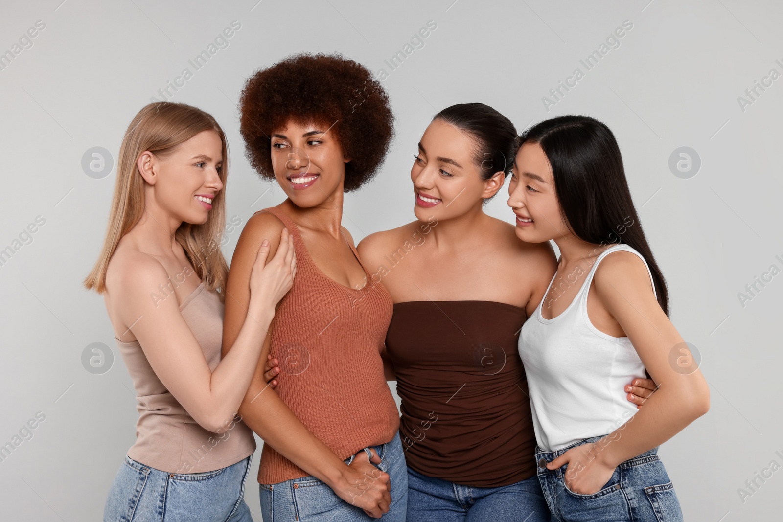 Photo of Portrait of beautiful young women on light grey background