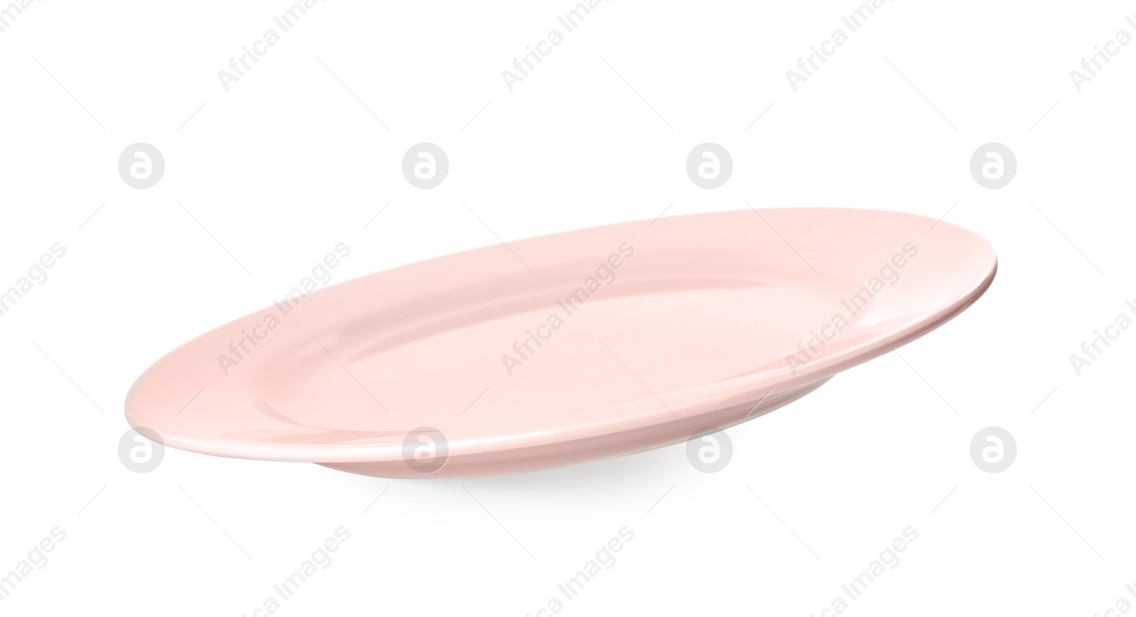 Photo of Clean light pink plate isolated on white