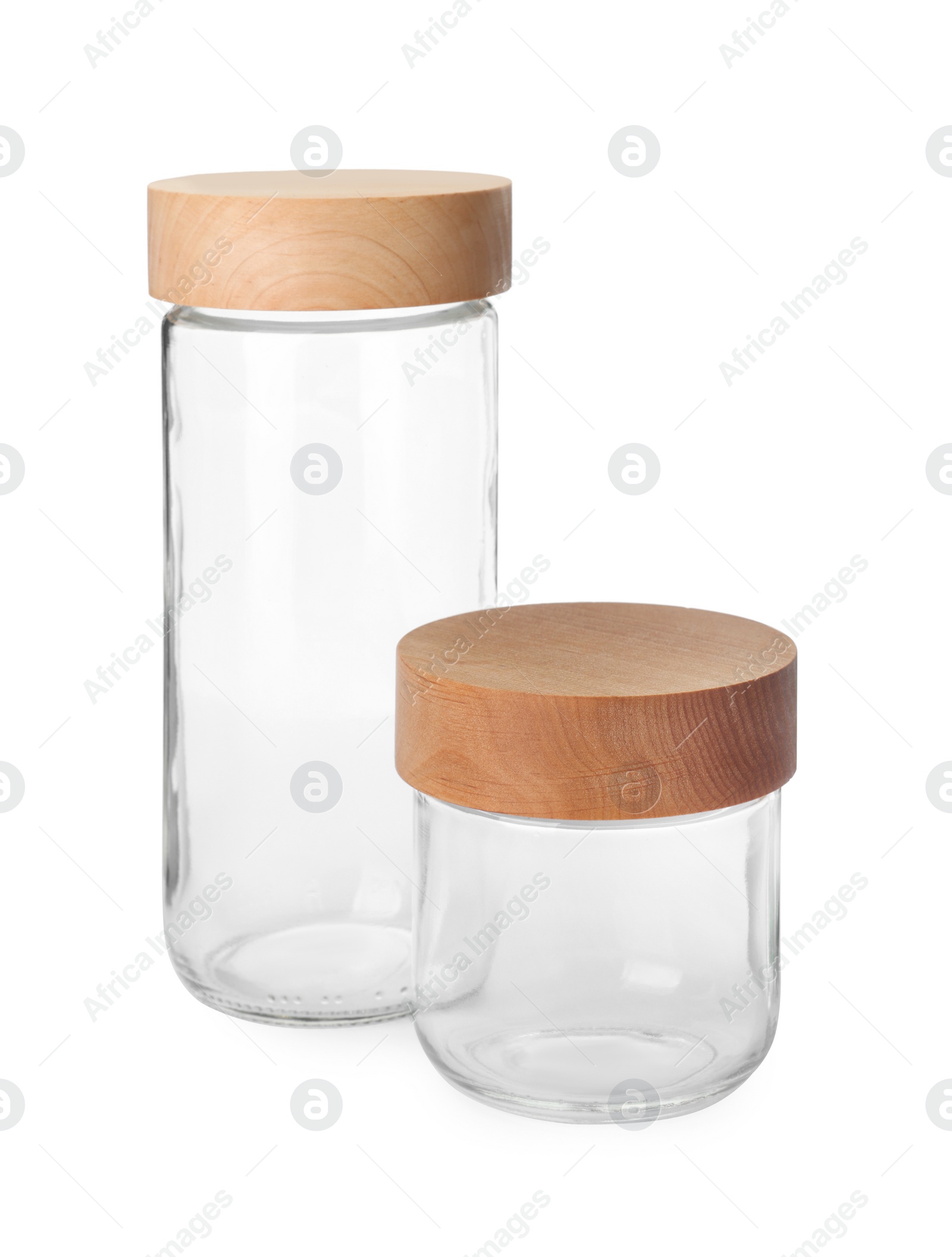 Photo of Two empty glass jars with wooden lids isolated on white