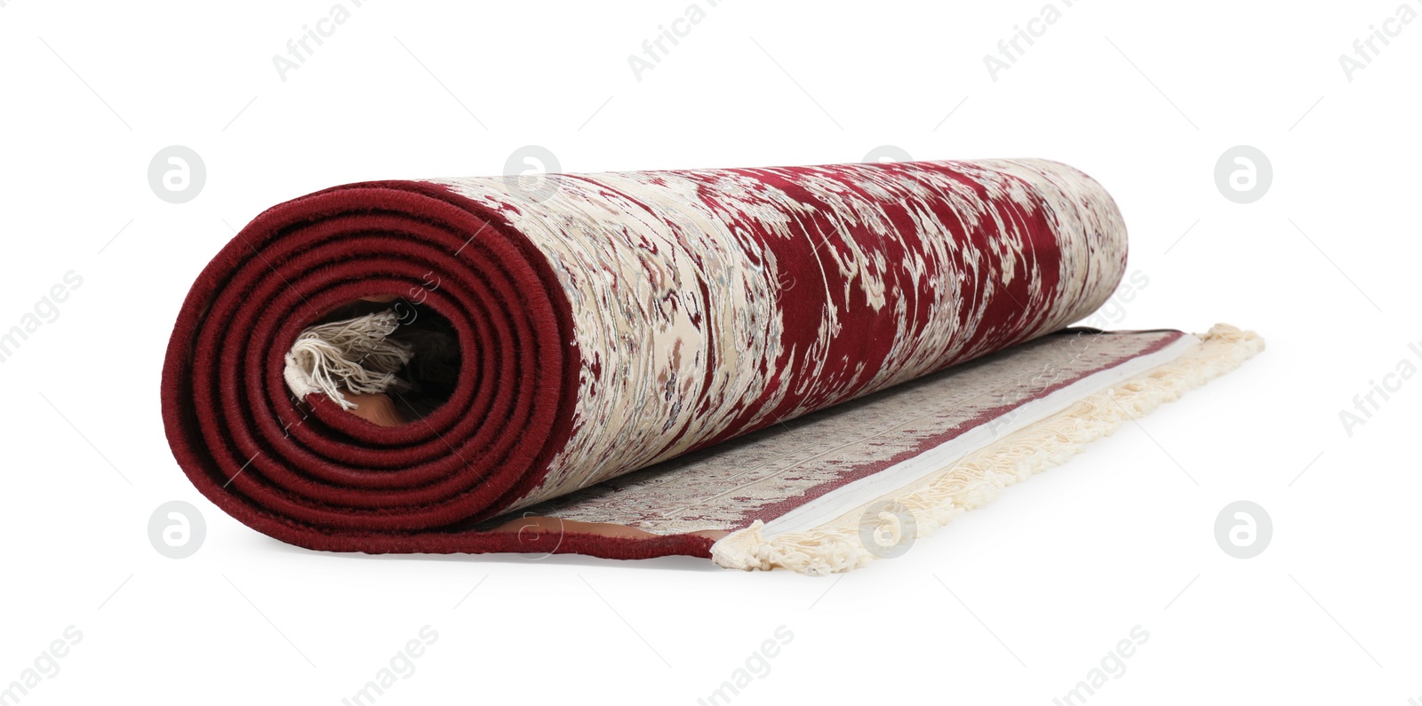 Photo of Rolled carpet with pattern on white background. Interior element