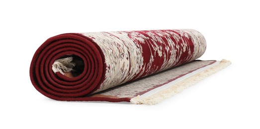 Rolled carpet with pattern on white background. Interior element