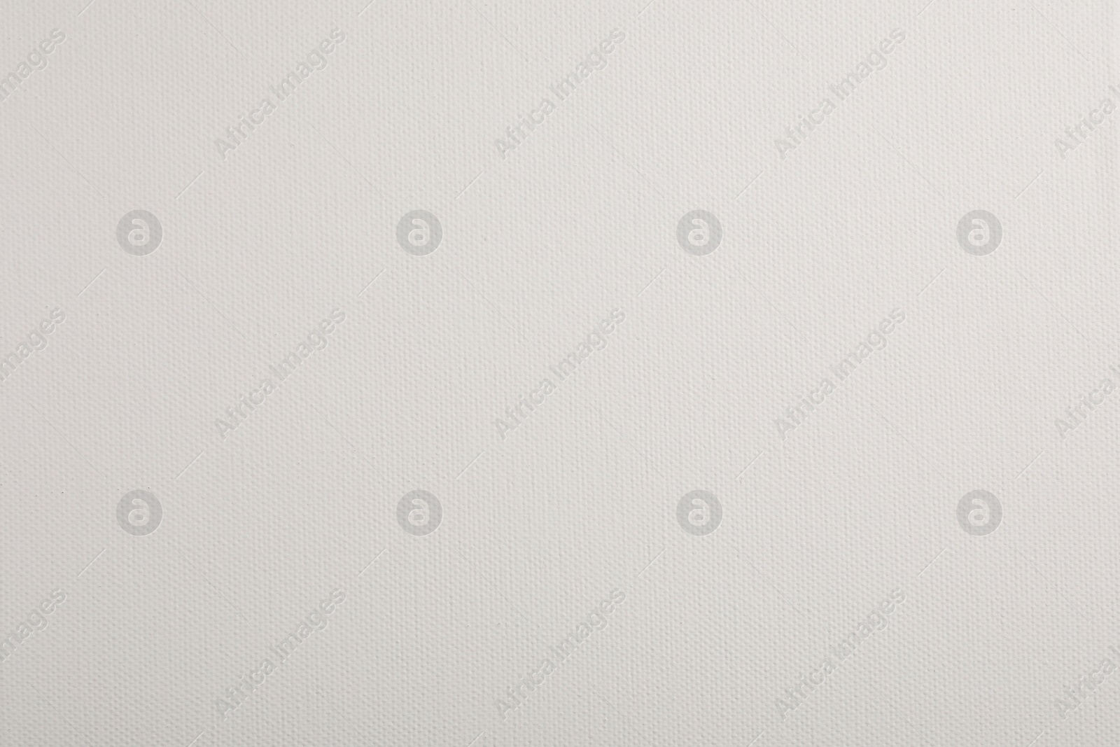 Photo of Blank white canvas as background, closeup view