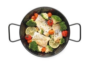 Tasty cod cooked with vegetables in frying pan isolated on white, top view