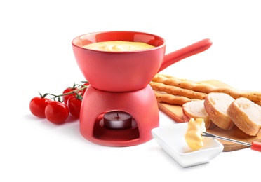 Delicious cheese fondue with tomatoes and bread on white background