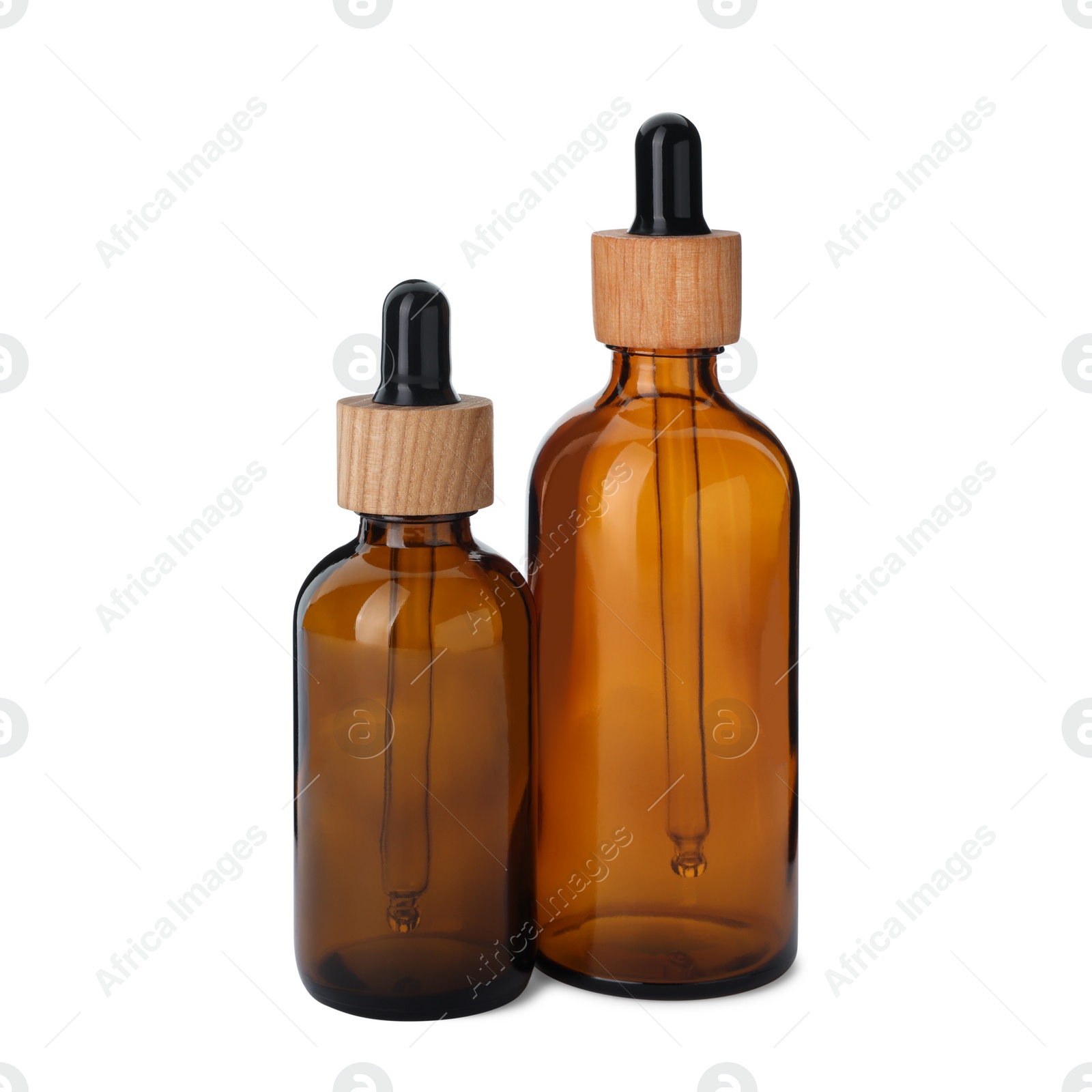 Photo of New empty glass bottles with droppers isolated on white