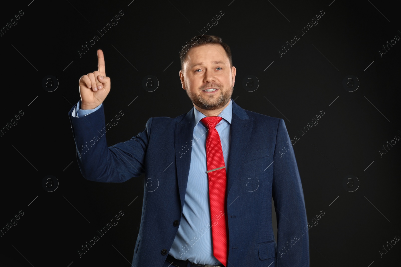 Photo of Portrait of happy mature man on black background