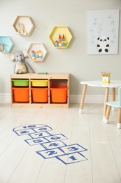 Photo of Blue hopscotch floor sticker in playing room