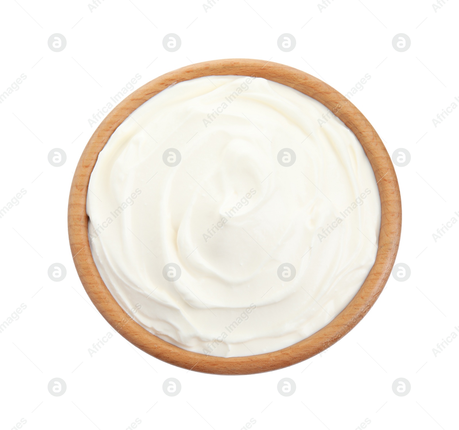 Photo of Wooden bowl with fresh sour cream isolated on white, top view