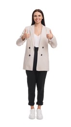 Photo of Beautiful businesswoman in suit showing thumbs up on white background