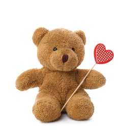 Photo of Cute teddy bear with red heart on white background. Valentine's day celebration