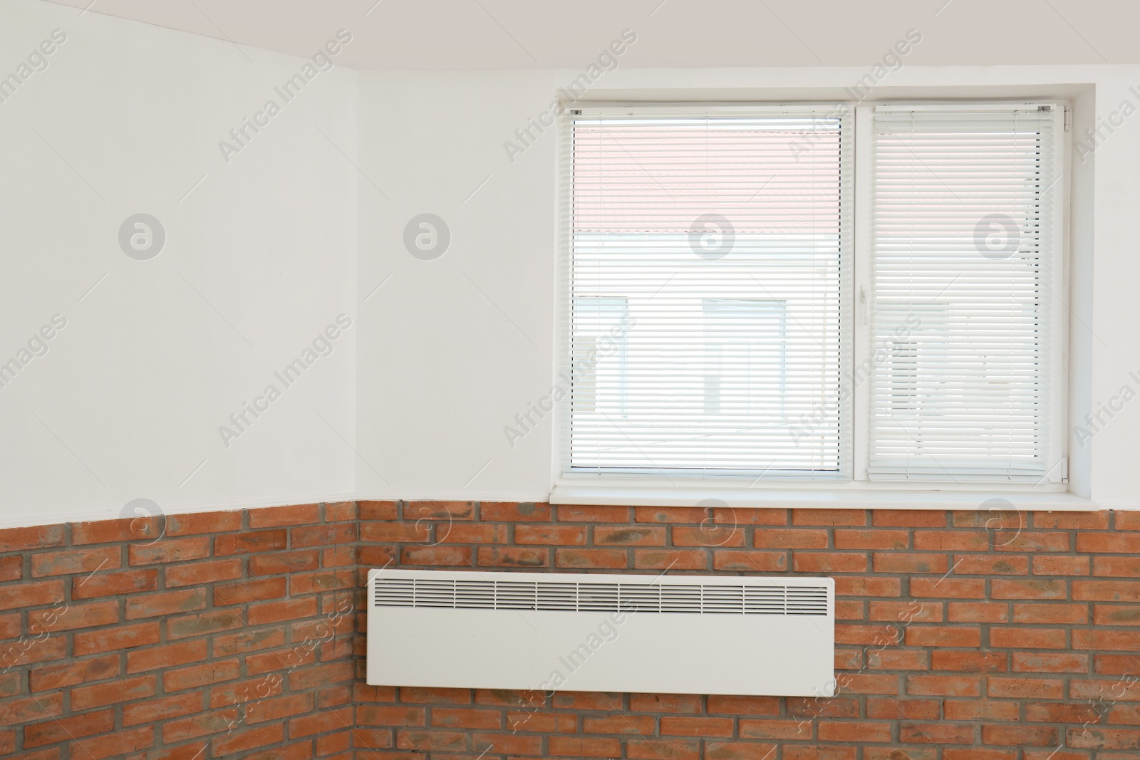 Photo of Modern window with blinds in room. Home interior