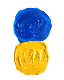 Photo of Yellow and blue paint circles drawn with brush on white background, top view