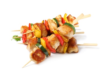 Photo of Delicious chicken shish kebabs with vegetables on white background