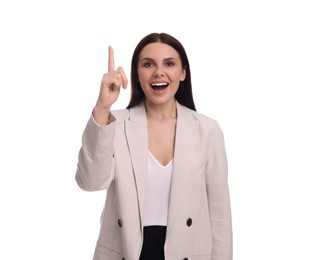 Beautiful businesswoman in suit pointing at something on white background
