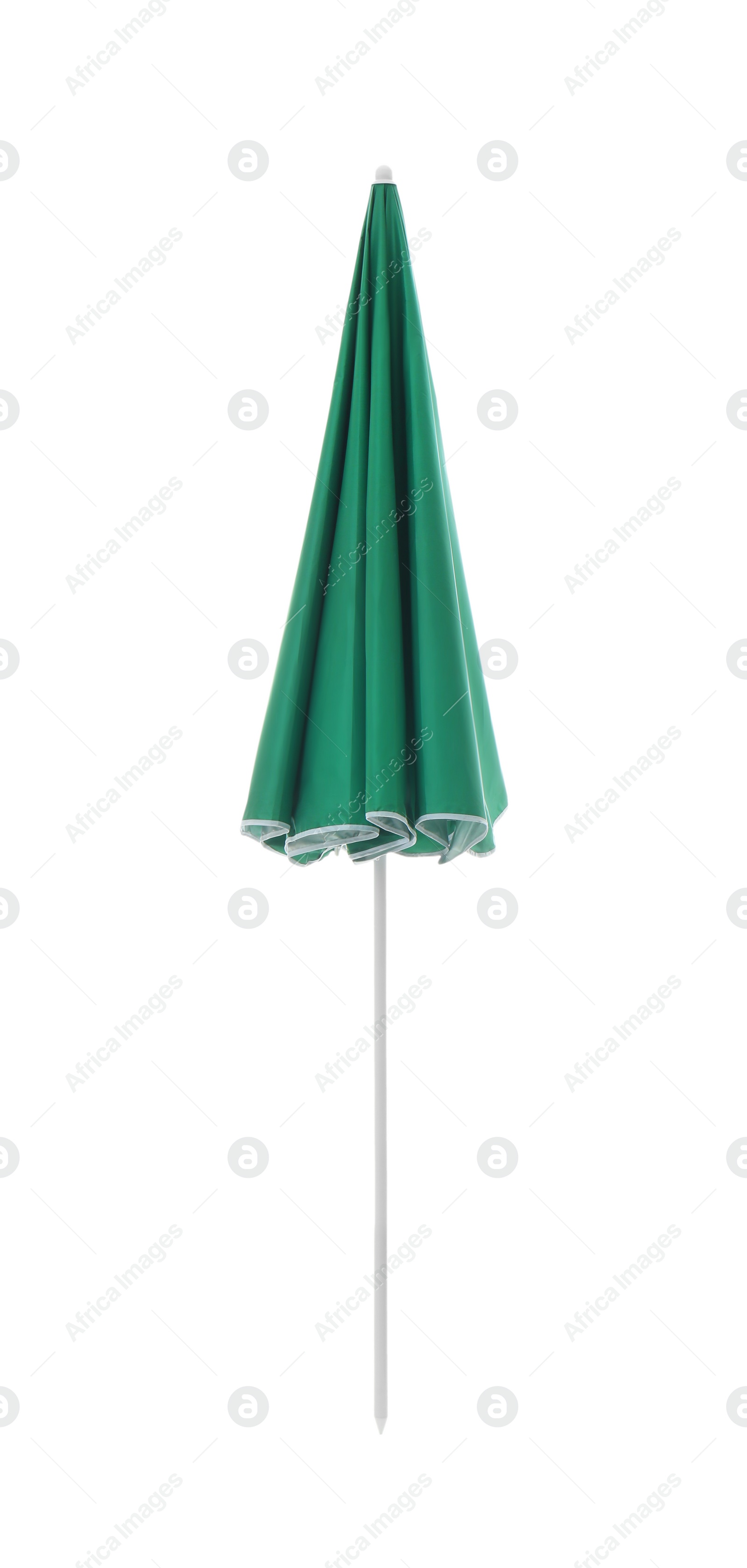Photo of Closed green beach umbrella isolated on white