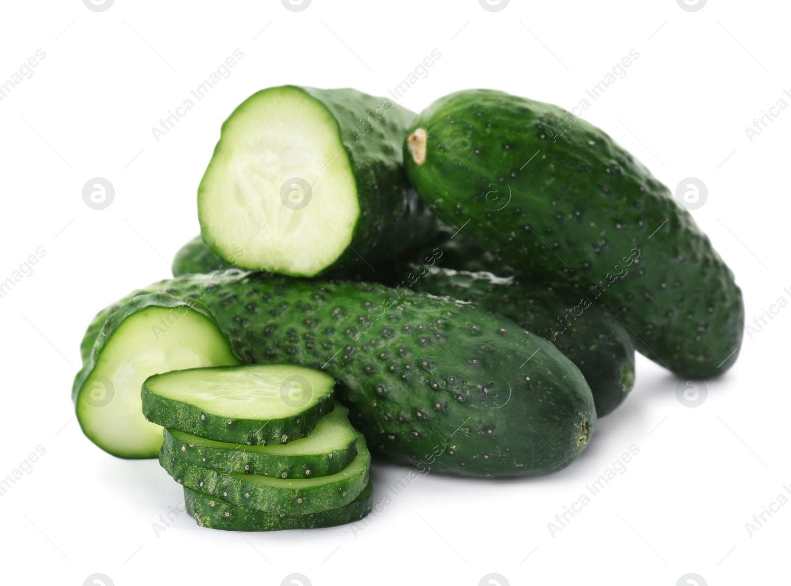 Photo of Whole and cut cucumbers on white background