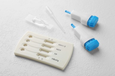 Disposable multi-infection express test kit on white table