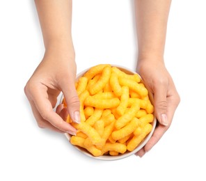 Photo of Woman holding bowl of crunchy cheesy corn sticks on white background, top view