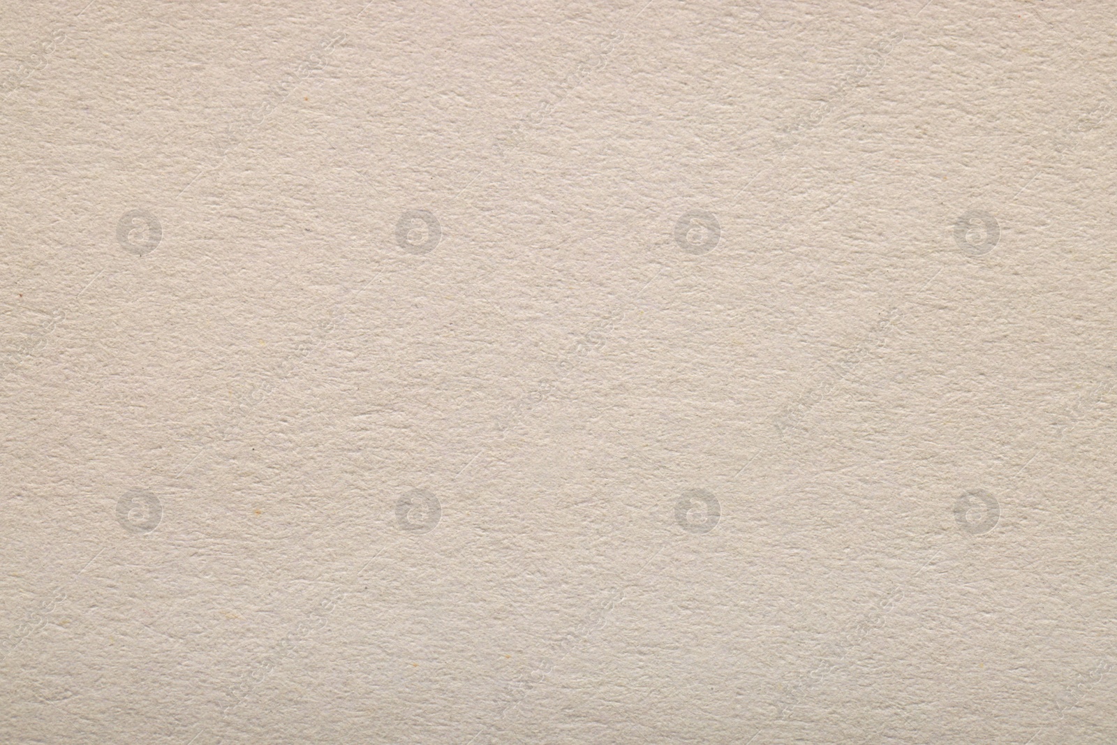 Photo of Texture of light grey paper sheet as background, top view