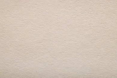 Photo of Texture of light grey paper sheet as background, top view