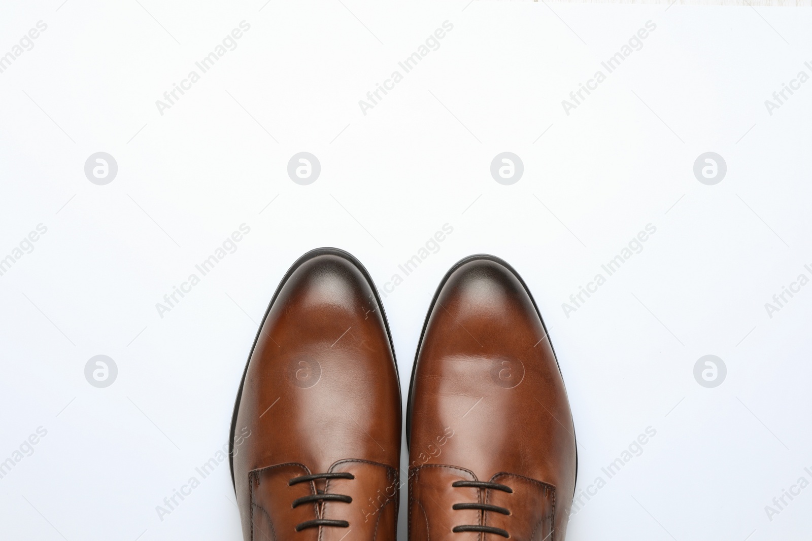 Photo of Wedding shoes on white background, top view