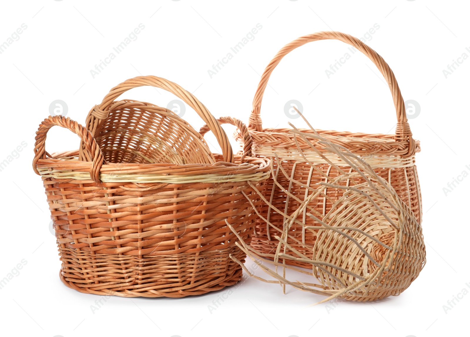 Photo of Many decorative wicker baskets on white background