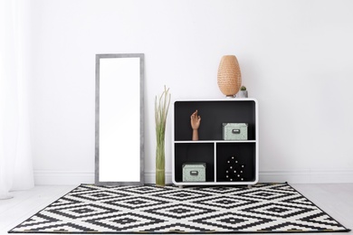 Elegant room interior with large mirror and shelving unit