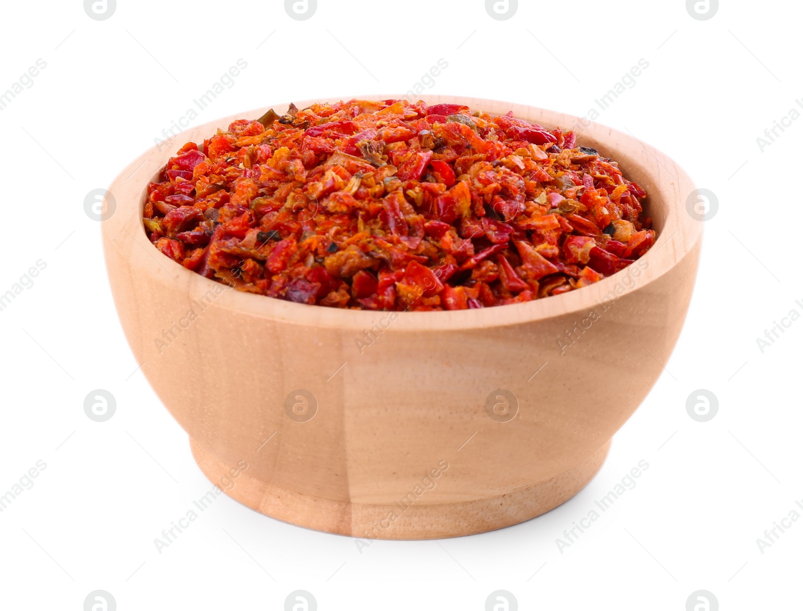 Photo of Aromatic spice. Red chili pepper flakes in bowl isolated on white